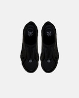 LA SXEPPA Black shoe, top-down view of the pair with the chrome medallion at the toe