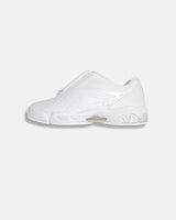 LA SXEPPA White shoe, side profile with the center zip and bubble sole